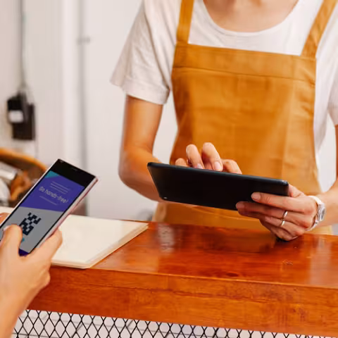 Staff member holding tablet