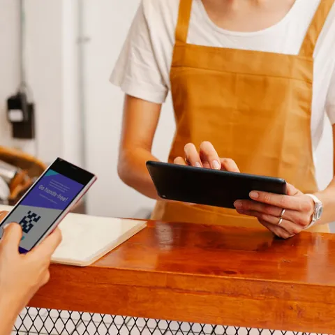 Staff member holding tablet