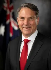 Richard Marles - Defence Minister standing in front of the Australian Flag